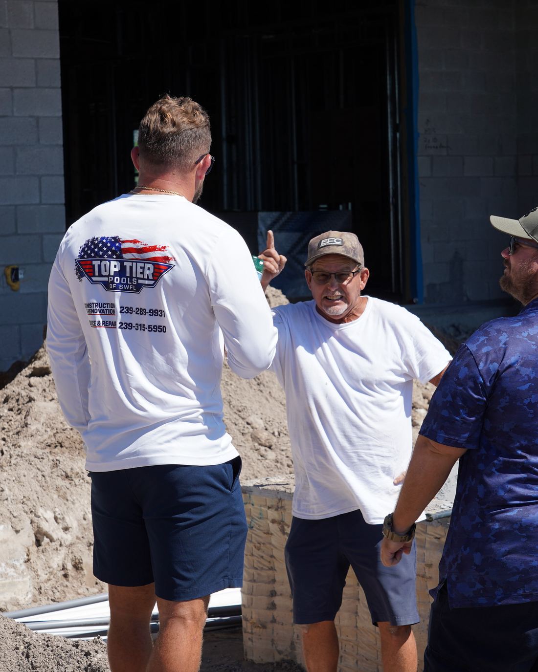 Ben and Blaine sharing a laugh on a Naples job site