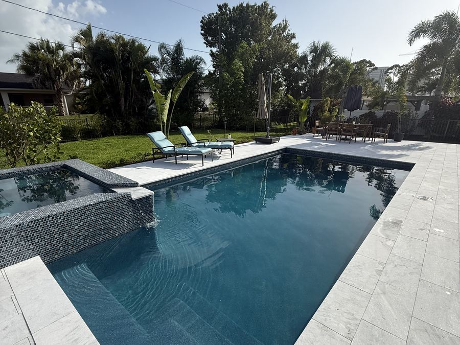Finished custom pool and raised spa built by Top Tier Pools