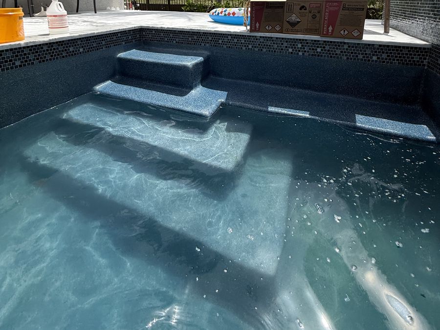 Spa steps leading into a pool