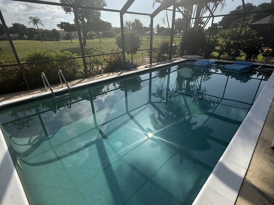 Renovated pool filled with clear blue water